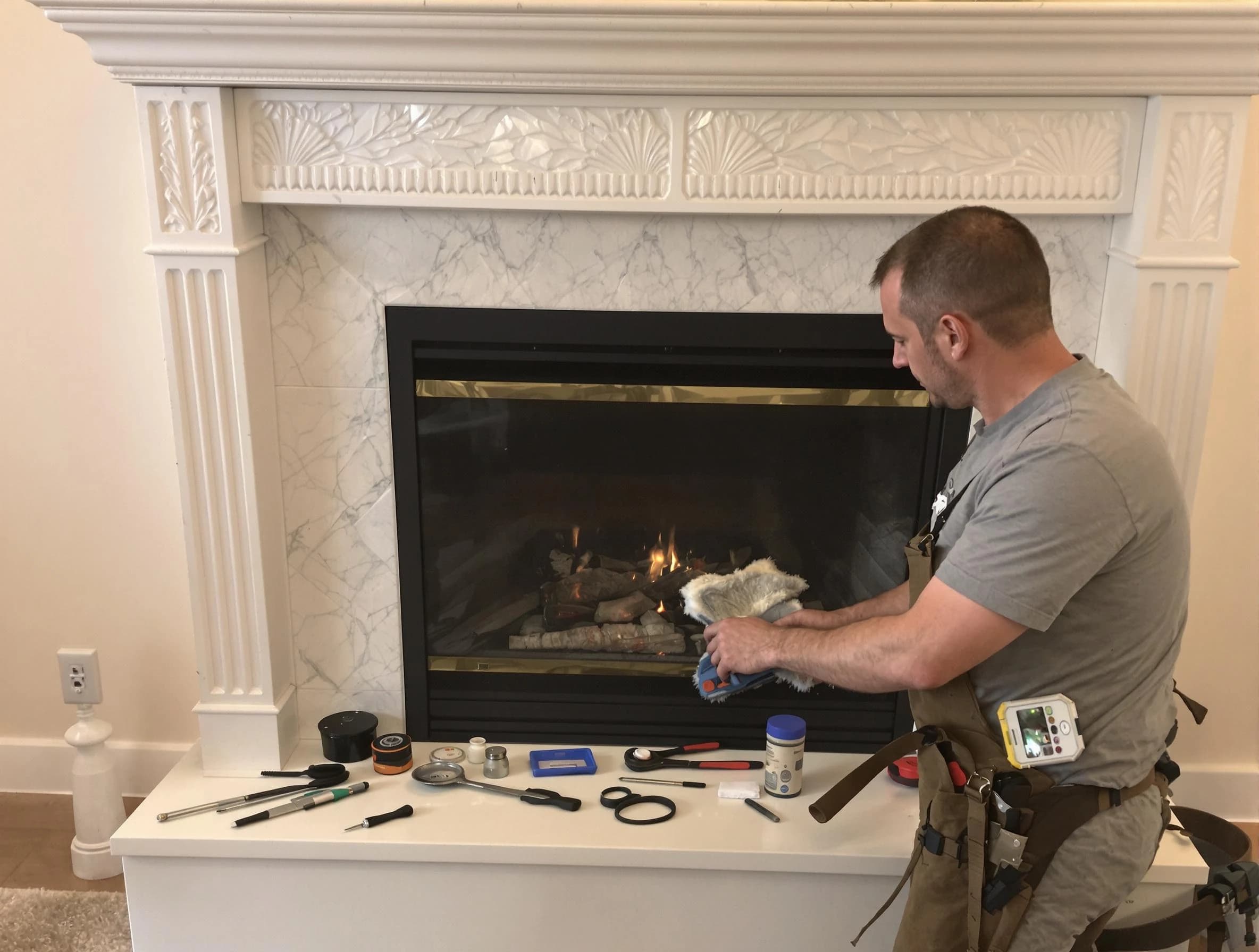 Fitchburg Chimney Sweep performing fireplace maintenance in Fitchburg, MA